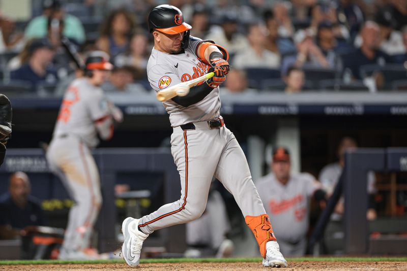 Jun 18, 2024; Bronx, New York, USA; Baltimore Orioles third baseman Ramon Urias (29) singles during the eighth inning against the New York Yankees at Yankee Stadium. Mandatory Credit: Vincent Carchietta-USA TODAY Sports