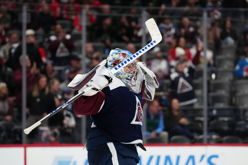 Mar 4, 2024; Denver, Colorado, USA; Colorado Avalanche goaltender Justus Annunen (60) celebrates defeating the Chicago Blackhawks  at Ball Arena. Mandatory Credit: Ron Chenoy-USA TODAY Sports