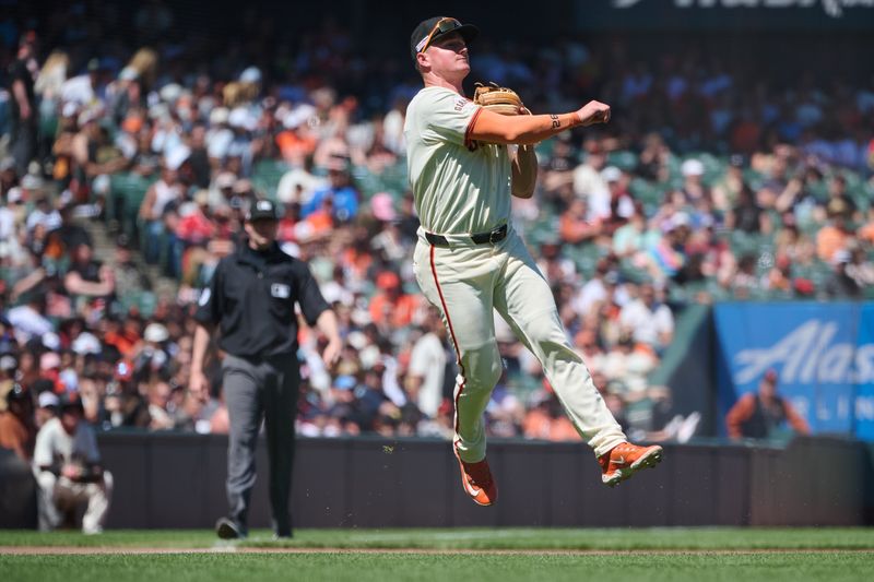 Jun 15, 2024; San Francisco, California, USA; San Francisco Giants infielder Matt Chapman (26) leaps and throws the ball to first base against the Los Angeles Angels during the eighth inning at Oracle Park. Mandatory Credit: Robert Edwards-USA TODAY Sports