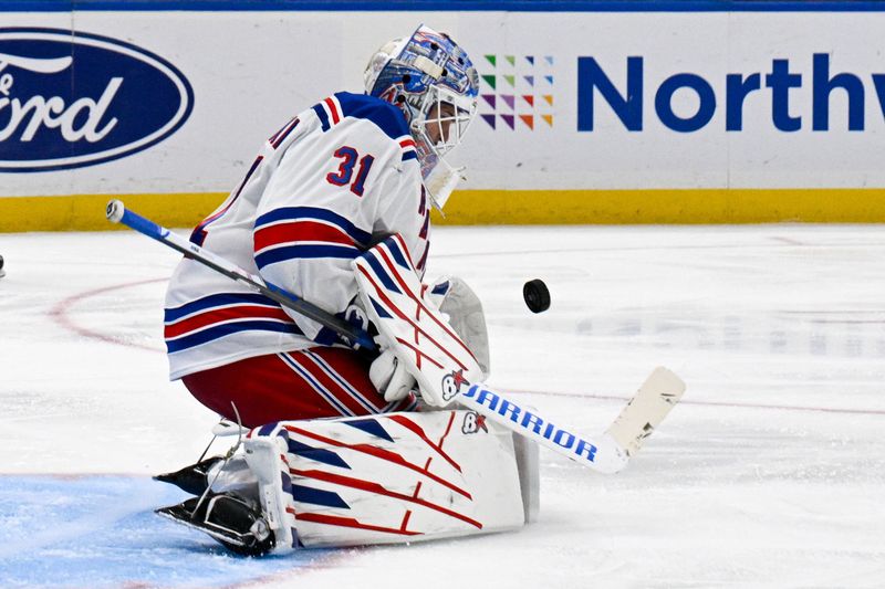 Feb 25, 2025; Elmont, New York, USA;  New York Rangers goaltender Igor Shesterkin (31) makes a save against the New York Islanders during the second period at UBS Arena. Mandatory Credit: Dennis Schneidler-Imagn Images