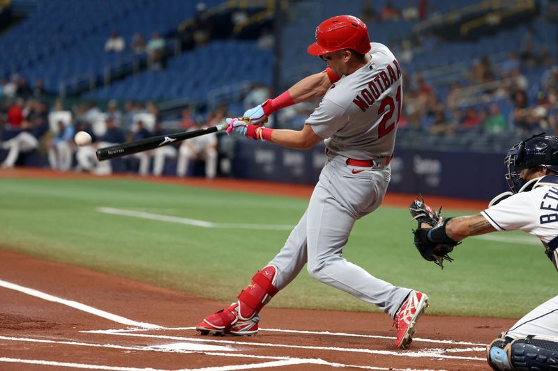 Aug 10, 2023; St. Petersburg, Florida, USA; St. Louis Cardinals center fielder Lars Nootbaar (21) doubles against the Tampa Bay Rays during the first inning at Tropicana Field. Mandatory Credit: Kim Klement Neitzel-USA TODAY Sports