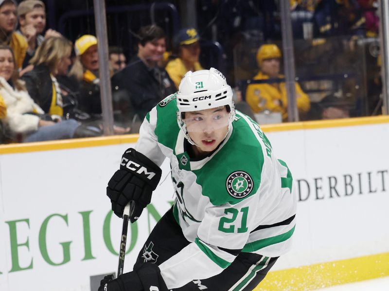 Nov 8, 2025; Nashville, Tennessee, USA; Dallas Stars left wing Jason Robertson (21) moves the puck during the second period against the Nashville Predators at Bridgestone Arena. Mandatory Credit: Alan Poizner-Imagn Images