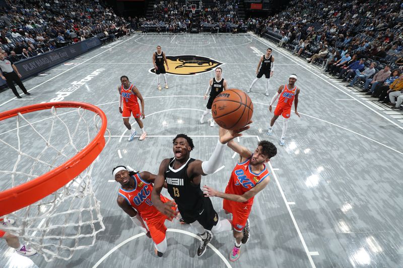 MEMPHIS, TN - MARCH 16:  Jaren Jackson Jr. #13 of the Memphis Grizzlies drives to the basket during the game against the Oklahoma City Thunder on March 16, 2024 at FedExForum in Memphis, Tennessee. NOTE TO USER: User expressly acknowledges and agrees that, by downloading and or using this photograph, User is consenting to the terms and conditions of the Getty Images License Agreement. Mandatory Copyright Notice: Copyright 2024 NBAE (Photo by Joe Murphy/NBAE via Getty Images)