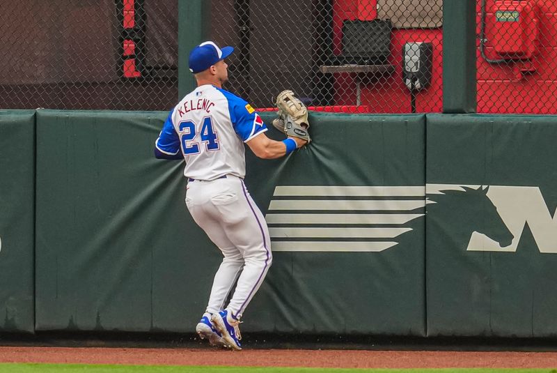 Jul 6, 2024; Cumberland, Georgia, USA; Atlanta Braves outfielder Jarred Kelenic (24) runs into the wall after catching a ball hit by Philadelphia Phillies shortstop Trea Turner (7) (not pictured) during the first inning at Truist Park. Mandatory Credit: Dale Zanine-USA TODAY Sports