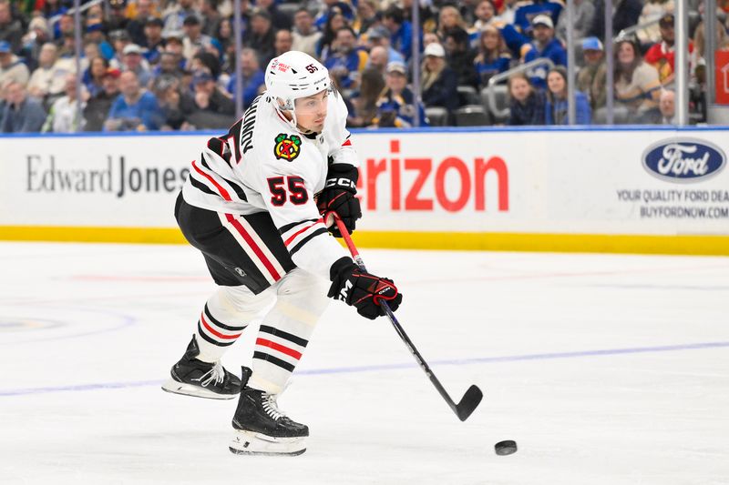 Mar 22, 2025; St. Louis, Missouri, USA;  Chicago Blackhawks defenseman Artyom Levshunov (55) shoots against the St. Louis Blues during the first period at Enterprise Center. Mandatory Credit: Jeff Curry-Imagn Images