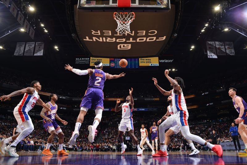 PHOENIX, AZ - FEBRUARY 14:  Josh Okogie #2 of the Phoenix Suns reaches for a rebound during the game against the Detroit Pistons on February 14, 2024 at Footprint Center in Phoenix, Arizona. NOTE TO USER: User expressly acknowledges and agrees that, by downloading and or using this photograph, user is consenting to the terms and conditions of the Getty Images License Agreement. Mandatory Copyright Notice: Copyright 2024 NBAE (Photo by Barry Gossage/NBAE via Getty Images)