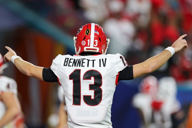 Dec 31, 2021; Miami Gardens, Florida, USA; Georgia Bulldogs quarterback Stetson Bennett (13) signals from the field prior the Orange Bowl college football CFP national semifinal game against the Michigan Wolverines at Hard Rock Stadium. Mandatory Credit: Sam Navarro-USA TODAY Sports