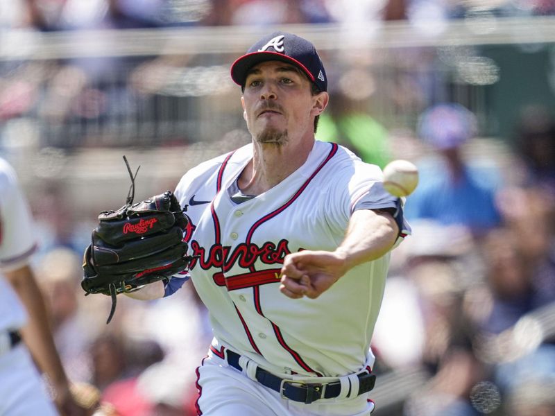 Apr 23, 2023; Cumberland, Georgia, USA; Atlanta Braves starting pitcher Max Fried (54) throws out Houston Astros center fielder Jake Meyers (6) (not shown) at third base after fielding a bunt during the sixth inning at Truist Park. Mandatory Credit: Dale Zanine-USA TODAY Sports