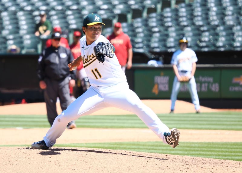 May 17, 2023; Oakland, California, USA; Oakland Athletics relief pitcher Shintaro Fujinami (11) pitches the ball against the Arizona Diamondbacks during the eighth inning at Oakland-Alameda County Coliseum. Mandatory Credit: Kelley L Cox-USA TODAY Sports