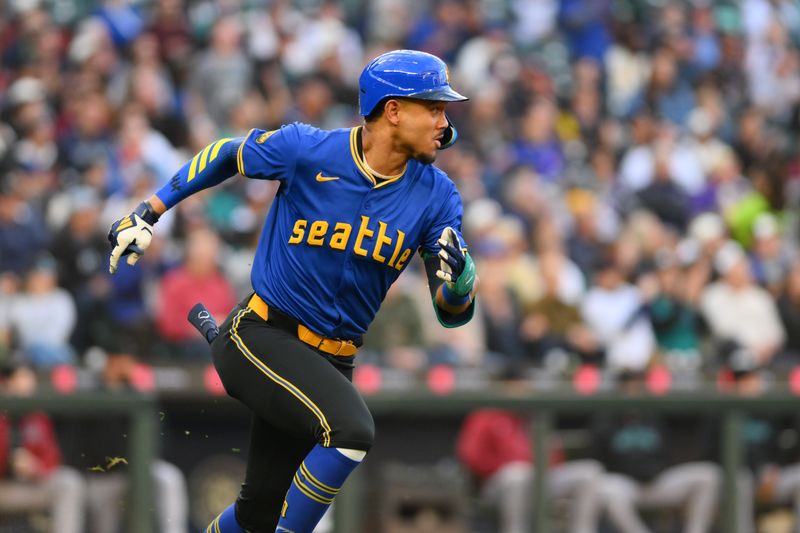 Apr 26, 2024; Seattle, Washington, USA; Seattle Mariners center fielder Julio Rodriguez (44) runs towards first base after hitting a single against the Arizona Diamondbacks during the third inning at T-Mobile Park. Mandatory Credit: Steven Bisig-USA TODAY Sports