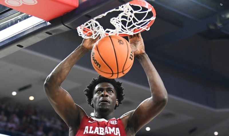 Feb 11, 2023; Auburn, Alabama, USA;  Alabama Crimson Tide center Charles Bediako (14) dunks against the Auburn Tigers at Neville Arena. Mandatory Credit: Julie Bennett-USA TODAY Sports

