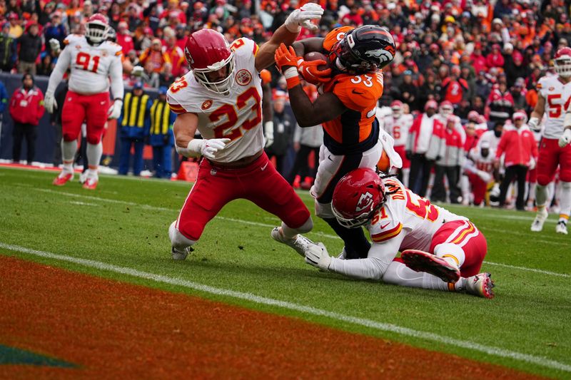 Denver Broncos running back Javonte Williams (33) celebrates a touchdown against the Kansas City Chiefs of an NFL football game Sunday October 29, 2023, in Denver. (AP Photo/Bart Young)