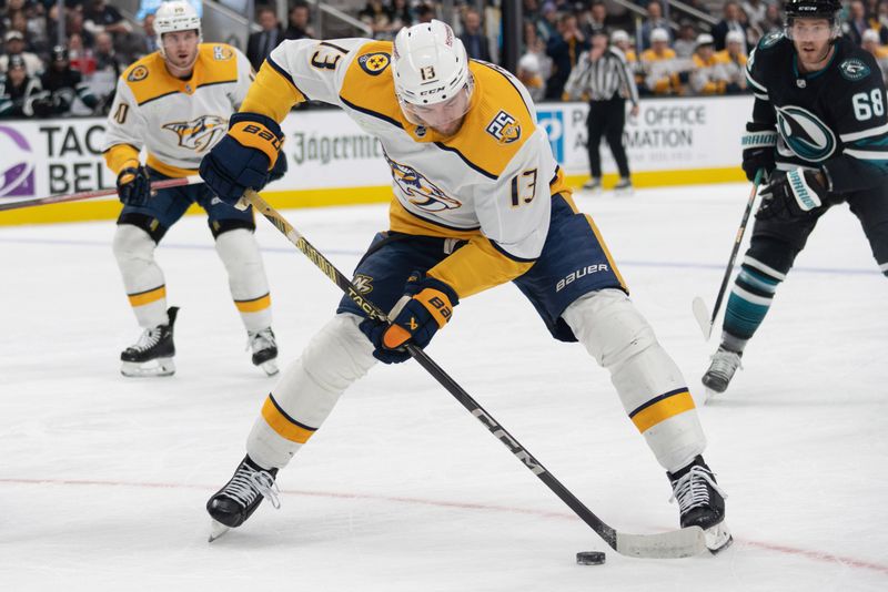 Feb 24, 2024; San Jose, California, USA; Nashville Predators center Yakov Trenin (13) controls the puck during the first period against the San Jose Sharks at SAP Center at San Jose. Mandatory Credit: Stan Szeto-USA TODAY Sports