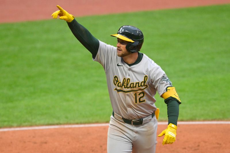 Apr 20, 2024; Cleveland, Ohio, USA; Oakland Athletics third baseman Max Schuemann (12) celebrates his solo home run in the fifth inning against the Cleveland Guardians at Progressive Field. Mandatory Credit: David Richard-USA TODAY Sports