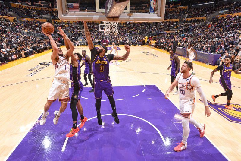 LOS ANGELES, CA - JANUARY 11: Devin Booker #1 of the Phoenix Suns drives to the basket during the game against the Los Angeles Lakers on January 11, 2024 at Crypto.Com Arena in Los Angeles, California. NOTE TO USER: User expressly acknowledges and agrees that, by downloading and/or using this Photograph, user is consenting to the terms and conditions of the Getty Images License Agreement. Mandatory Copyright Notice: Copyright 2024 NBAE (Photo by Andrew D. Bernstein/NBAE via Getty Images)