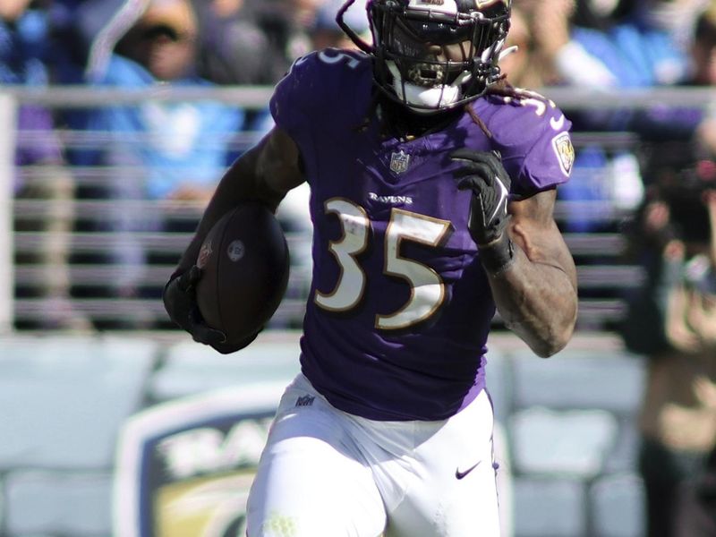 Baltimore Ravens running back Gus Edwards (35) runs during an NFL football game against the Detroit Lions, Sunday, October 22, 2023 in Baltimore, Maryland. (AP Photo/Daniel Kucin Jr.)