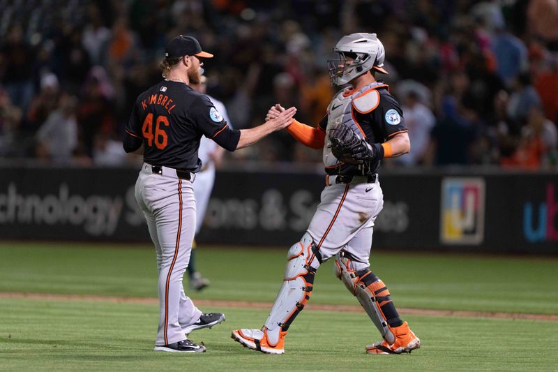 Jul 5, 2024; Oakland, California, USA;  Baltimore Orioles pitcher Craig Kimbrel (46) celebrates with catcher James McCann (27) after defeating the Oakland Athletics at Oakland-Alameda County Coliseum. Mandatory Credit: Stan Szeto-USA TODAY Sports