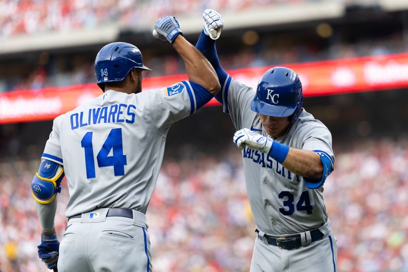 Aug 5, 2023; Philadelphia, Pennsylvania, USA; Kansas City Royals catcher Freddy Fermin (34) celebrates with left fielder Edward Olivares (14) after hitting a home run during the second inning Philadelphia Phillies at Citizens Bank Park. Mandatory Credit: Bill Streicher-USA TODAY Sports