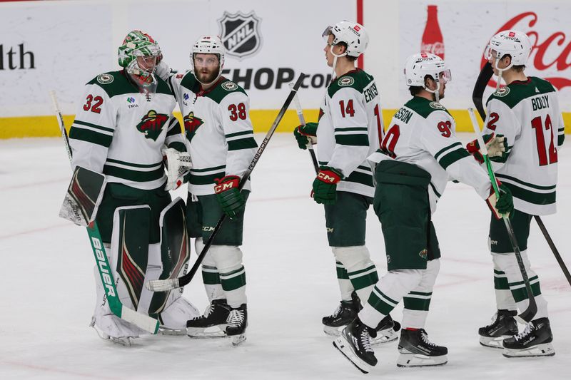 Jan 19, 2024; Sunrise, Florida, USA; Minnesota Wild goaltender Filip Gustavsson (32) celebrates with right wing Ryan Hartman (38), center Joel Eriksson Ek (14), Minnesota Wild left wing Marcus Johansson (90) and left wing Matt Boldy (12) after winning the game against the Florida Panthers at Amerant Bank Arena. Mandatory Credit: Sam Navarro-USA TODAY Sports