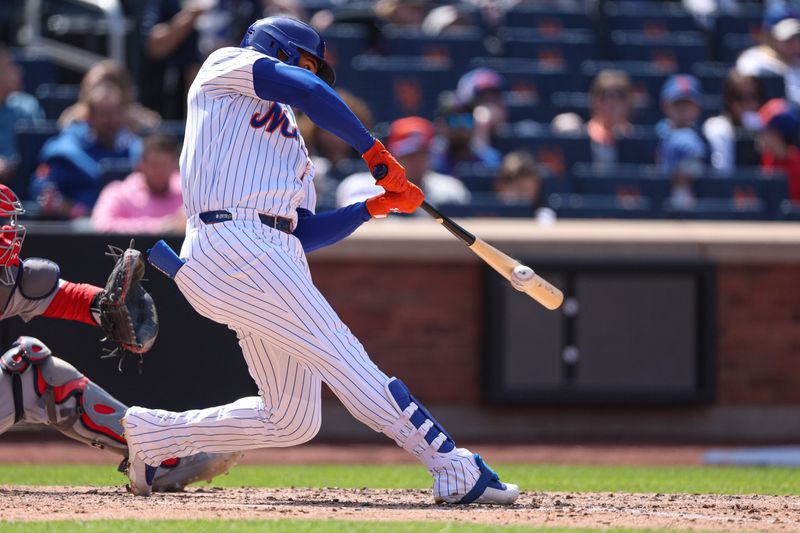 Apr 20, 2025; New York City, New York, USA; New York Mets right fielder Juan Soto (22) singles during the fifth inning against the St. Louis Cardinals at Citi Field. Mandatory Credit: Vincent Carchietta-Imagn Images