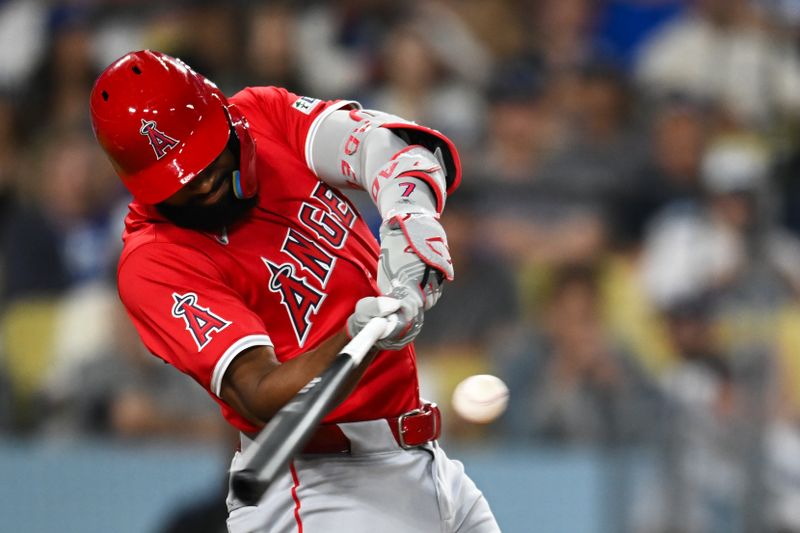 Jun 22, 2024; Los Angeles, California, USA; Los Angeles Angels outfielder Jo Adell (7) flies out against the Los Angeles Dodgers during the eighth inning at Dodger Stadium. Mandatory Credit: Jonathan Hui-USA TODAY Sports