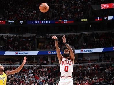 CHICAGO, IL - DECEMBER 28: Coby White #0 of the Chicago Bulls shoots a three point basket during the game against the Indiana Pacers on December 28, 2023 at United Center in Chicago, Illinois. NOTE TO USER: User expressly acknowledges and agrees that, by downloading and or using this photograph, User is consenting to the terms and conditions of the Getty Images License Agreement. Mandatory Copyright Notice: Copyright 2023 NBAE (Photo by Jeff Haynes/NBAE via Getty Images)