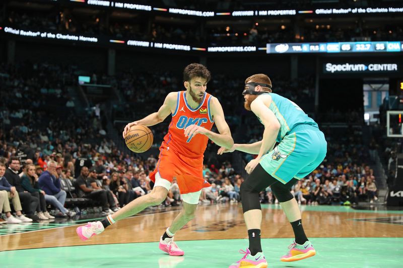 CHARLOTTE, NC - APRIL 7: Chet Holmgren #7 of the Oklahoma City Thunder dribbles the ball during the game against the Charlotte Hornets  on April 7, 2024 at Spectrum Center in Charlotte, North Carolina. NOTE TO USER: User expressly acknowledges and agrees that, by downloading and or using this photograph, User is consenting to the terms and conditions of the Getty Images License Agreement.  Mandatory Copyright Notice:  Copyright 2024 NBAE (Photo by Brock Williams-Smith/NBAE via Getty Images)