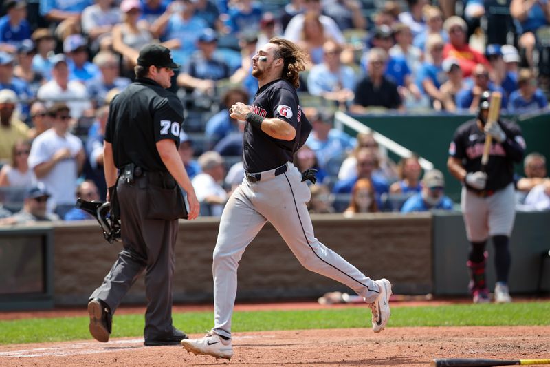 Jun 30, 2024; Kansas City, Missouri, USA; Cleveland Guardians shortstop Daniel Schneemann (10) crosses home plate for a run during the eighth inning against the Kansas City Royals at Kauffman Stadium. Mandatory Credit: William Purnell-USA TODAY Sports