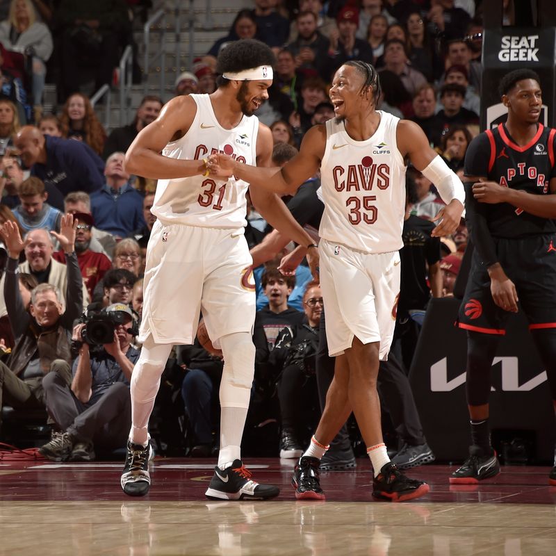 CLEVELAND, OH - NOVEMBER 24: Jarrett Allen #31 and Isaac Okoro #35 of the Cleveland Cavaliers celebrates during the game against the Toronto Raptors on November 24, 2024 at Rocket Mortgage FieldHouse in Cleveland, Ohio. NOTE TO USER: User expressly acknowledges and agrees that, by downloading and/or using this Photograph, user is consenting to the terms and conditions of the Getty Images License Agreement. Mandatory Copyright Notice: Copyright 2024 NBAE (Photo by David Liam Kyle/NBAE via Getty Images)