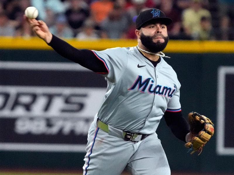 May 26, 2024; Phoenix, Arizona, USA; Miami Marlins third base Emmanuel Rivera (15) makes the play for an out against the Arizona Diamondbacks in the second inning at Chase Field. Mandatory Credit: Rick Scuteri-USA TODAY Sports