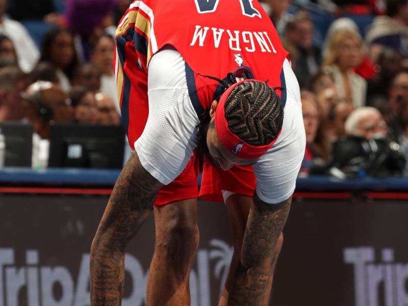 NEW ORLEANS, LA - NOVEMBER 15: Brandon Ingram #14 of the New Orleans Pelicans ties sneakers during the game against the Denver Nuggets during the Emirates NBA Cup game on November 15, 2024 at the Smoothie King Center in New Orleans, Louisiana. NOTE TO USER: User expressly acknowledges and agrees that, by downloading and or using this Photograph, user is consenting to the terms and conditions of the Getty Images License Agreement. Mandatory Copyright Notice: Copyright 2024 NBAE (Photo by Layne Murdoch Jr./NBAE via Getty Images)