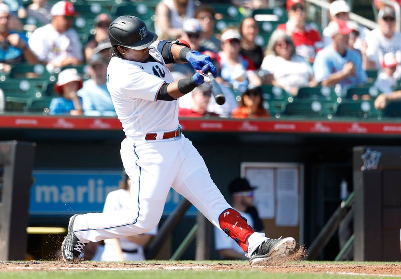 Feb 26, 2023; Jupiter, Florida, USA; Miami Marlins third baseman Jean Segura (9) bats during the second inning against the St. Louis Cardinals at Roger Dean Stadium. Mandatory Credit: Rhona Wise-USA TODAY Sports