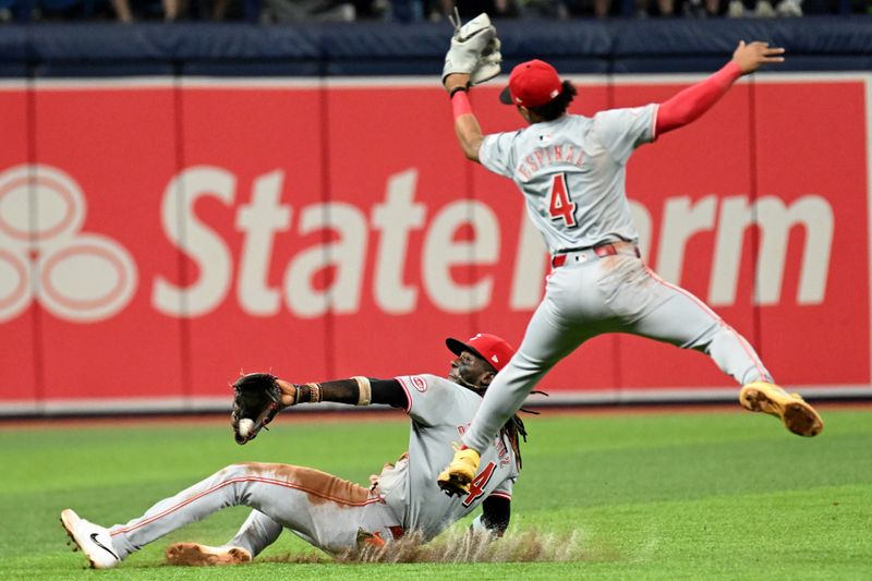 Jul 28, 2024; St. Petersburg, Florida, USA;   Cincinnati Reds short stop Elly De La Cruz (44) catches a fly ball in the sixth inning against the Tampa Bay Rays at Tropicana Field. Mandatory Credit: Jonathan Dyer-USA TODAY Sports