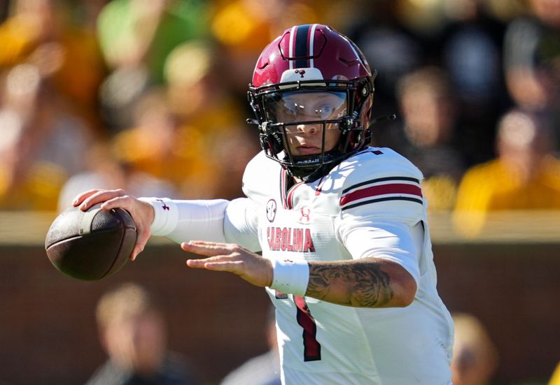 Oct 21, 2023; Columbia, Missouri, USA; South Carolina Gamecocks quarterback Spencer Rattler (7) throws a pass against the Missouri Tigers during the first half at Faurot Field at Memorial Stadium. Mandatory Credit: Jay Biggerstaff-USA TODAY Sports