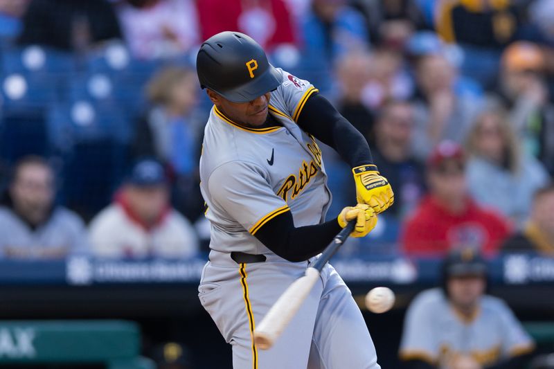 Apr 13, 2024; Philadelphia, Pennsylvania, USA; Pittsburgh Pirates third base Ke'Bryan Hayes (13) hits an RBI double during the first inning against the Philadelphia Phillies at Citizens Bank Park. Mandatory Credit: Bill Streicher-USA TODAY Sports