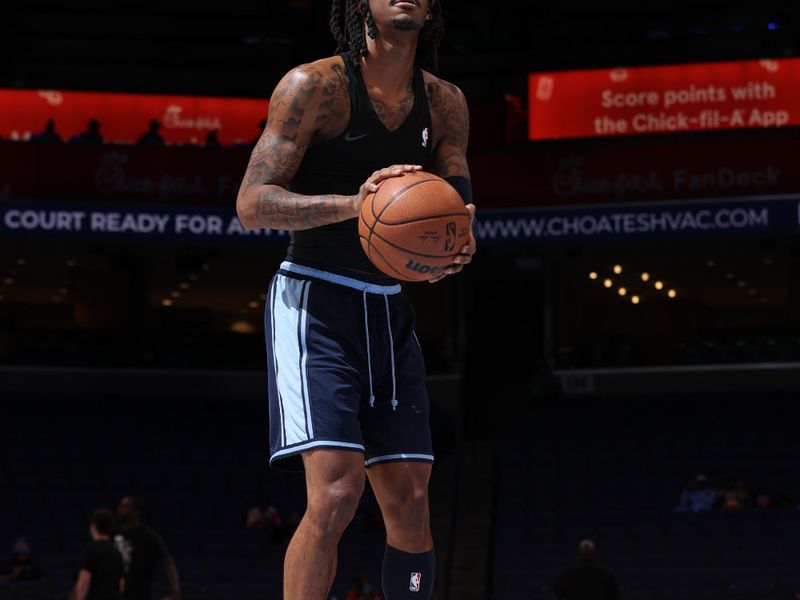 MEMPHIS, TN - DECEMBER 13:  Ja Morant #12 of the Memphis Grizzlies warms up before the game against the Brooklyn Nets on December 13, 2024 at FedExForum in Memphis, Tennessee. NOTE TO USER: User expressly acknowledges and agrees that, by downloading and or using this photograph, User is consenting to the terms and conditions of the Getty Images License Agreement. Mandatory Copyright Notice: Copyright 2024 NBAE (Photo by Joe Murphy/NBAE via Getty Images)