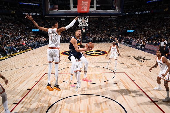 DENVER, CO - NOVEMBER 26: Michael Porter Jr. #1 of the Denver Nuggets drives to the basket during the game against the San Antonio Spurs on November 26, 2023 at the Ball Arena in Denver, Colorado. NOTE TO USER: User expressly acknowledges and agrees that, by downloading and/or using this Photograph, user is consenting to the terms and conditions of the Getty Images License Agreement. Mandatory Copyright Notice: Copyright 2023 NBAE (Photo by Garrett Ellwood/NBAE via Getty Images)