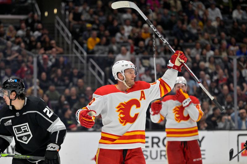 Apr 11, 2024; Los Angeles, California, USA; Calgary Flames center Jonathan Huberdeau (10) celebrates after scoring a goal in the third period against the Los Angeles Kings at Crypto.com Arena. Mandatory Credit: Jayne Kamin-Oncea-USA TODAY Sports