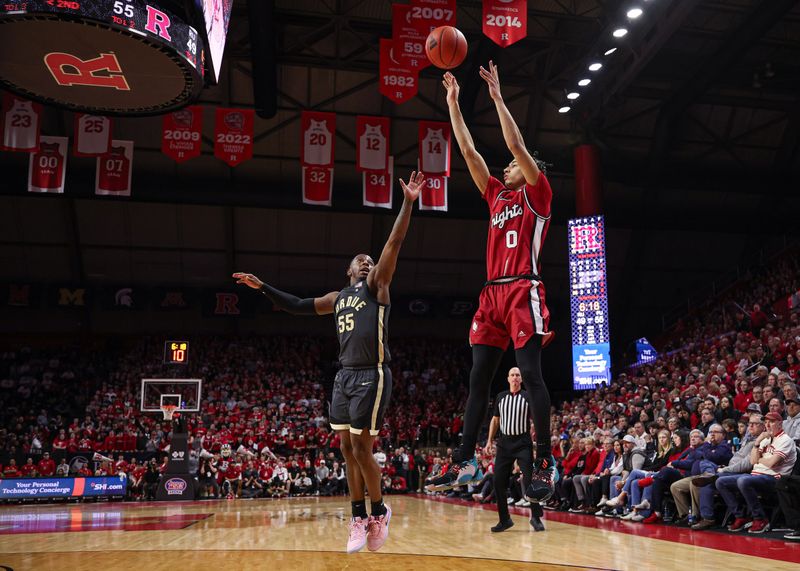 Jan 28, 2024; Piscataway, New Jersey, USA; Rutgers Scarlet Knights guard Derek Simpson (0) shoots the ball as Purdue Boilermakers guard Lance Jones (55) defends during the second half at Jersey Mike's Arena. Mandatory Credit: Vincent Carchietta-USA TODAY Sports