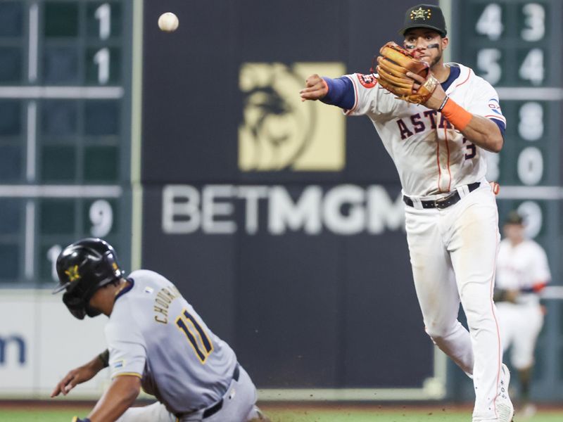 May 18, 2024; Houston, Texas, USA; Houston Astros shortstop Jeremy Pena (3) forces Milwaukee Brewers left fielder Jackson Chourio (11) at second base and turns a double play in the seventh inning at Minute Maid Park. Mandatory Credit: Thomas Shea-USA TODAY Sports