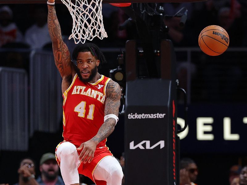 ATLANTA, GEORGIA - FEBRUARY 10:  Saddiq Bey #41 of the Atlanta Hawks dunks against the Houston Rockets during the fourth quarter at State Farm Arena on February 10, 2024 in Atlanta, Georgia.  NOTE TO USER: User expressly acknowledges and agrees that, by downloading and/or using this photograph, user is consenting to the terms and conditions of the Getty Images License Agreement.  (Photo by Kevin C. Cox/Getty Images)