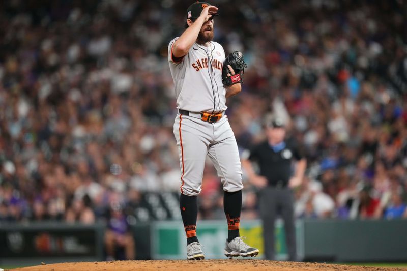 Jul 19, 2024; Denver, Colorado, USA; San Francisco Giants relief pitcher Ryan Walker (74) reacts in the seventh inning against the Colorado Rockies at Coors Field. Mandatory Credit: Ron Chenoy-USA TODAY Sports