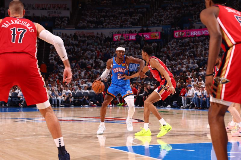 OKLAHOMA CITY, OK - APRIL 24: Shai Gilgeous-Alexander #2 of the Oklahoma City Thunder dribbles the ball during the game against the New Orleans Pelicans during Round 1 Game 2 of the 2024 NBA Playoffs on April 24, 2024 at Paycom Arena in Oklahoma City, Oklahoma. NOTE TO USER: User expressly acknowledges and agrees that, by downloading and or using this photograph, User is consenting to the terms and conditions of the Getty Images License Agreement. Mandatory Copyright Notice: Copyright 2024 NBAE (Photo by Zach Beeker/NBAE via Getty Images)