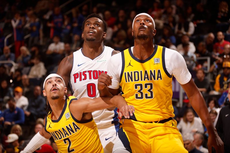 DETROIT, MI - OCTOBER 23: Andrew Nembhard #2 and Myles Turner #33 of the Indiana Pacers guard against Jalen Duren #0 of the Detroit Pistons during the game on October 23, 2024 at Little Caesars Arena in Detroit, Michigan. NOTE TO USER: User expressly acknowledges and agrees that, by downloading and/or using this photograph, User is consenting to the terms and conditions of the Getty Images License Agreement. Mandatory Copyright Notice: Copyright 2024 NBAE (Photo by Brian Sevald/NBAE via Getty Images)