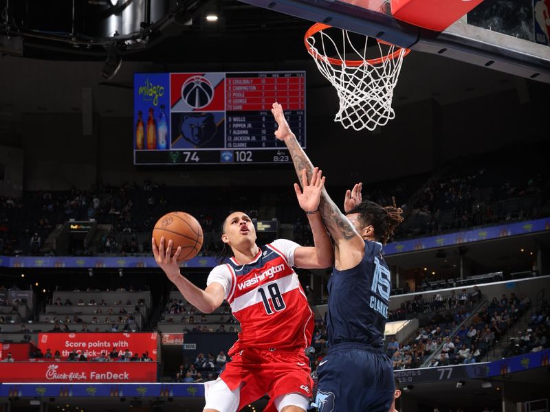 MEMPHIS, TN - NOVEMBER 8: Kyshawn George #18 of the Washington Wizards drives to the basket during the game against the Memphis Grizzlies on November 8, 2024 at FedExForum in Memphis, Tennessee. NOTE TO USER: User expressly acknowledges and agrees that, by downloading and or using this photograph, User is consenting to the terms and conditions of the Getty Images License Agreement. Mandatory Copyright Notice: Copyright 2024 NBAE (Photo by Joe Murphy/NBAE via Getty Images)