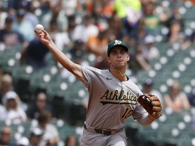 Jun 26, 2025; Detroit, Michigan, USA;  Athletics second base Max Muncy (10) makes a throw in the first inning against the Detroit Tigers at Comerica Park. Mandatory Credit: Rick Osentoski-Imagn Images
