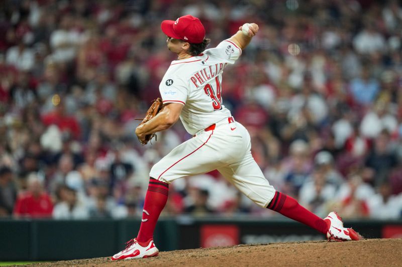 Jun 25, 2025; Cincinnati, Ohio, USA; Cincinnati Reds pitcher Connor Phillips throws against the New York Yankees in the eighth inning at Great American Ball Park. Mandatory Credit: Aaron Doster-Imagn Images