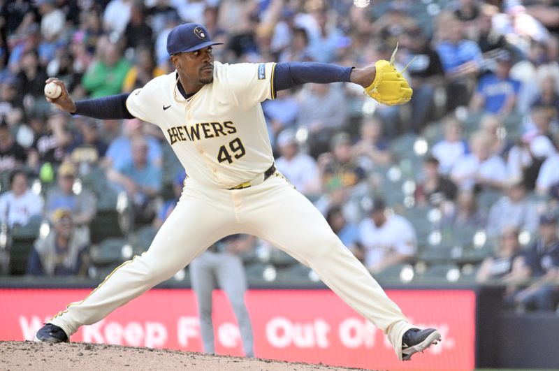 May 1, 2024; Milwaukee, Wisconsin, USA; Milwaukee Brewers relief pitcher Thyago Vieira (49) delivers a pitch against the Tampa Bay Rays in the ninth inning at American Family Field. Mandatory Credit: Michael McLoone-USA TODAY Sports