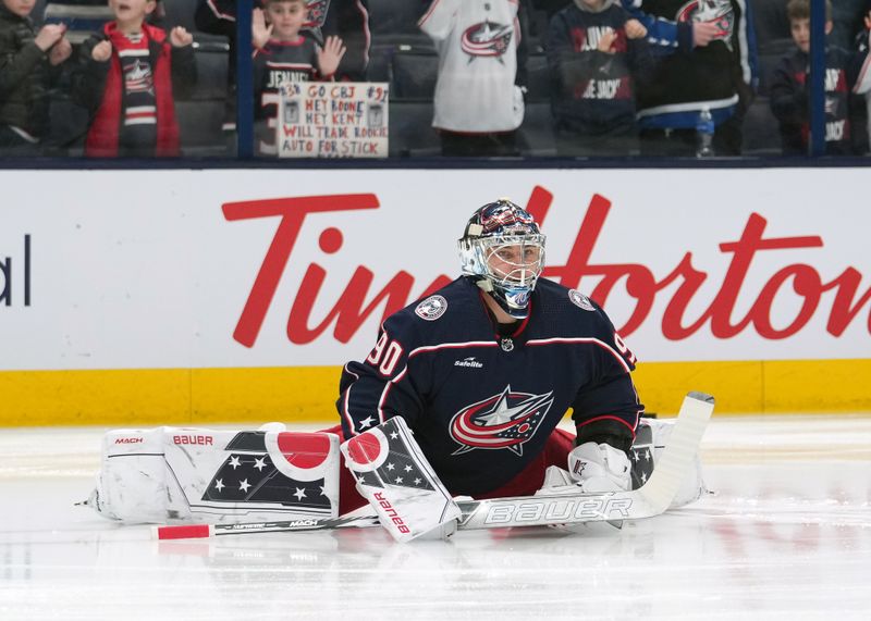 Mar 3, 2023; Columbus, Ohio, USA; Columbus Blue Jackets goaltender Elvis Merzlikins (90) stretching during warm-ups prior to the game against the Seattle Kraken at Nationwide Arena. Mandatory Credit: Jason Mowry-USA TODAY Sports