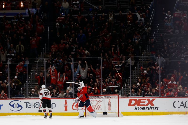 Mar 3, 2025; Washington, District of Columbia, USA; Washington Capitals goaltender Logan Thompson (48) celebrates after making the game-winning save on Ottawa Senators right wing Claude Giroux (28) in a shootout at Capital One Arena. Mandatory Credit: Geoff Burke-Imagn Images
